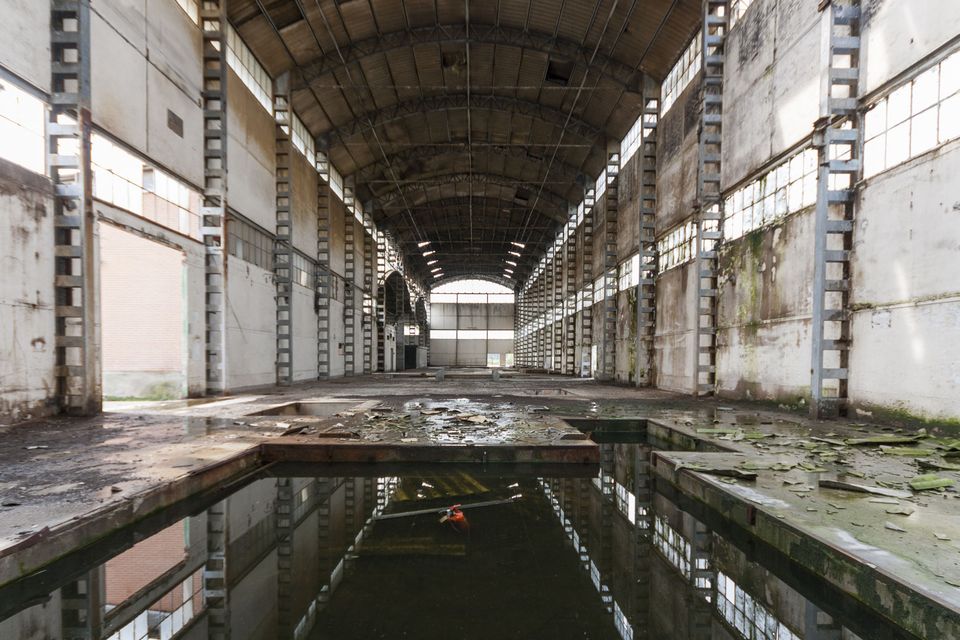 Arched hall with a flooded channel along its centre