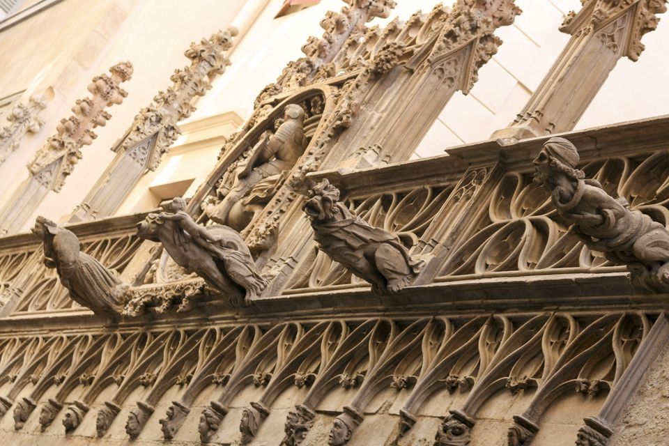 Carved gargoyles and tracery on a Gothic facade