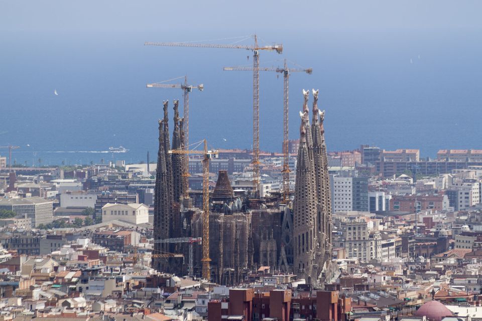 Sagrada Família with cranes seen over the rooftops