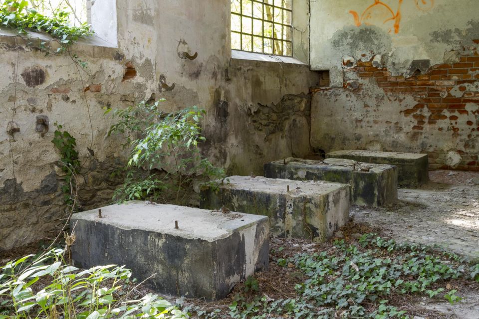 Concrete blocks on the floor of a roofless room