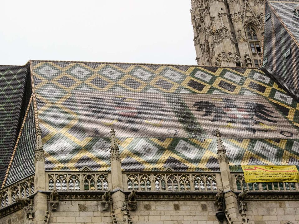 Patterned tile roof with a double eagle on a Gothic cathedral