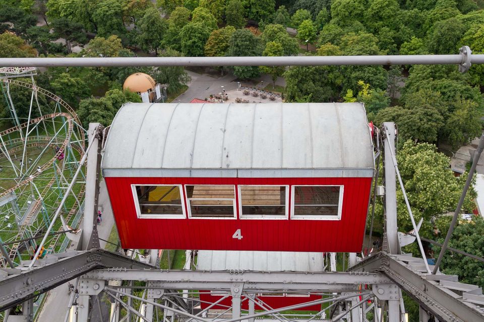 Red Ferris wheel gondola numbered 4 seen from above
