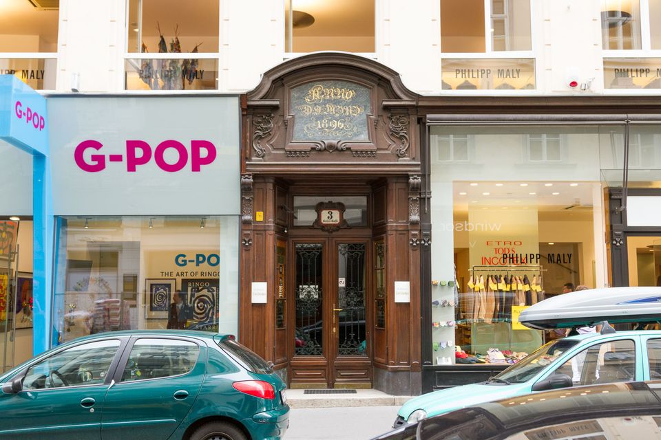 Carved wooden doorway between a shop and a pop gallery