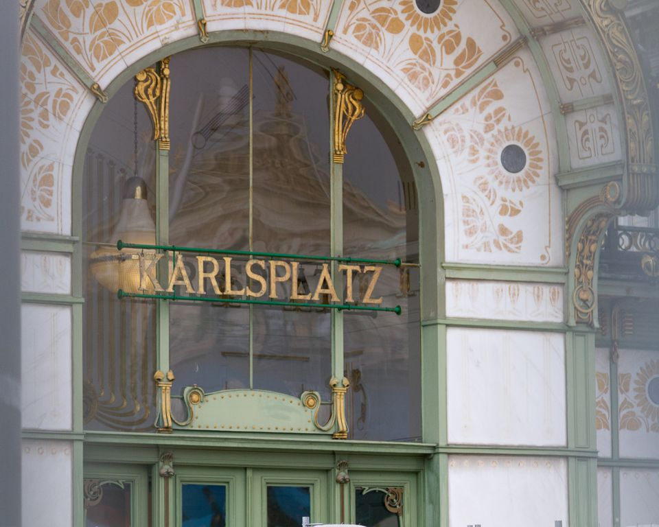 Art Nouveau station entrance with Karlsplatz lettering and floral tiles