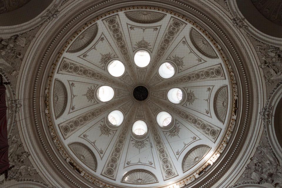 Domed ceiling with round skylights and plaster ornament