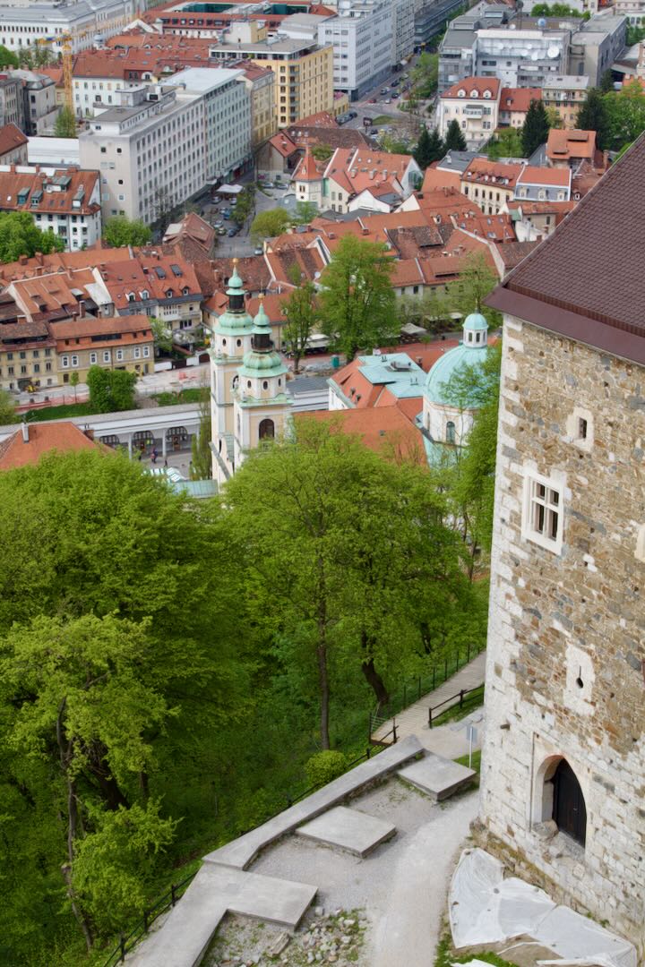Castle watchtower above the trees with the old town below