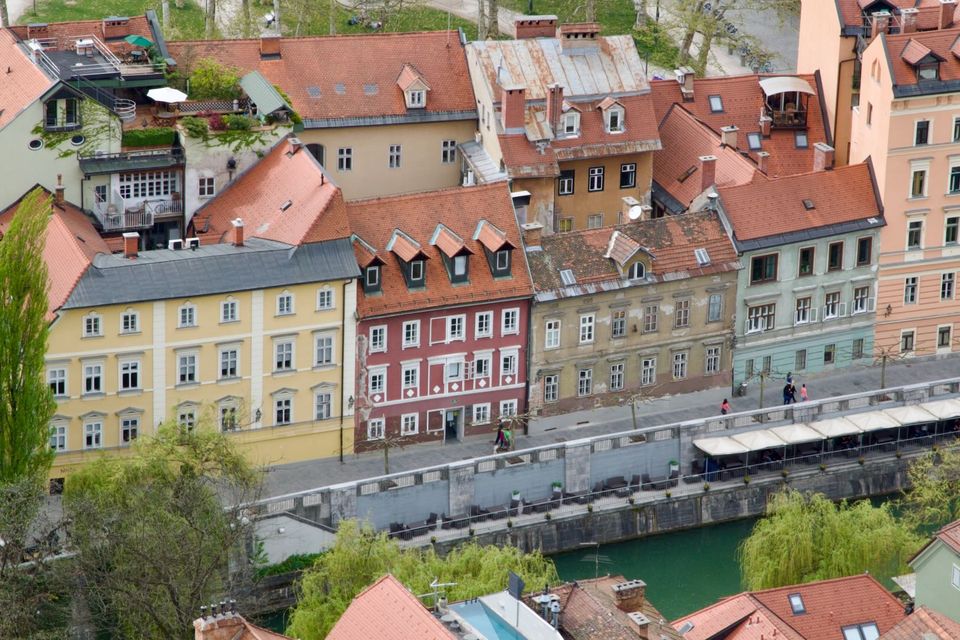 Colourful facades along the riverbank seen from above