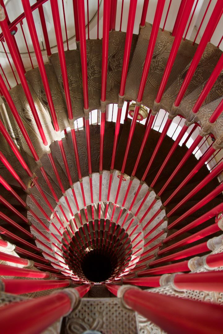 Red spiral staircase of the castle watchtower seen from below