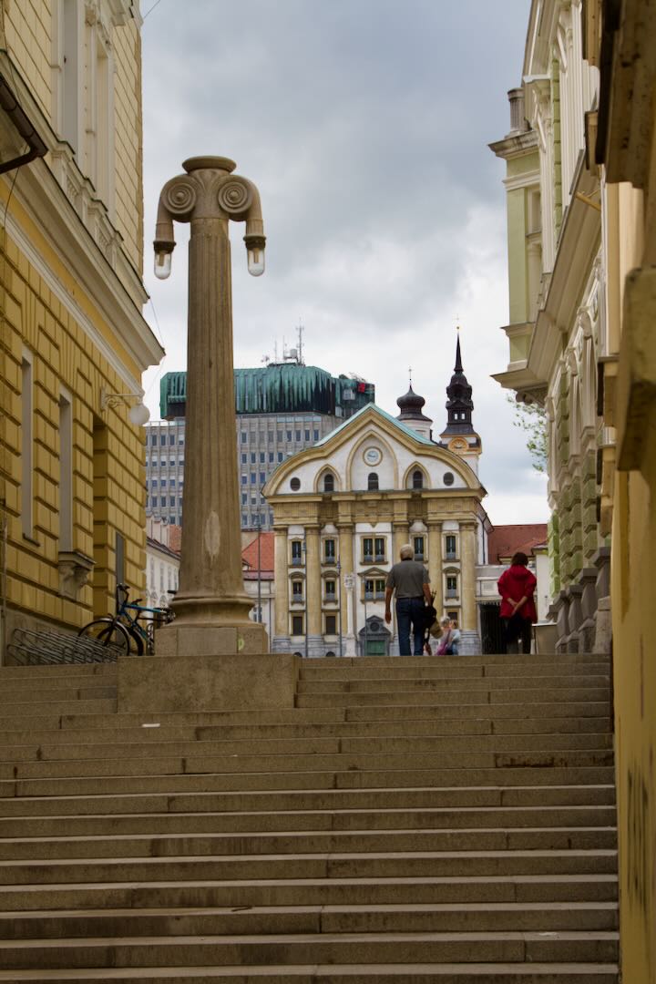 Stone steps and a tall column leading up to a square