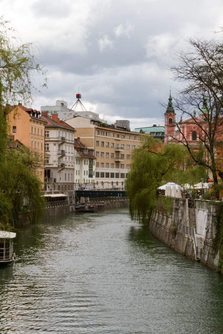 Ljubljanica flowing between rows of old riverside houses