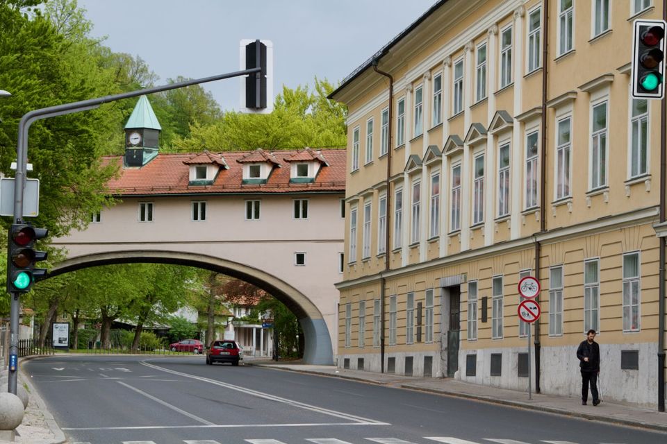 Covered arched bridge linking two buildings over a street