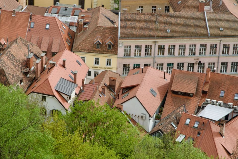 Jumble of red and brown rooftops seen from above